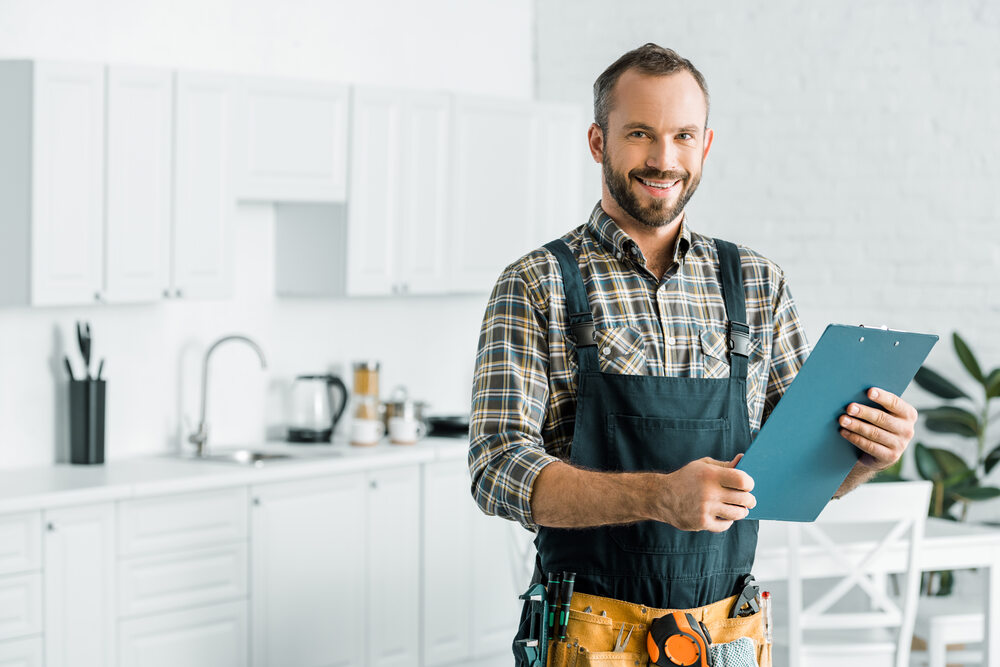 Plumber holding clipboard