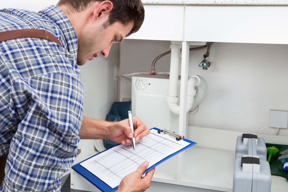 Plumber holding checklist