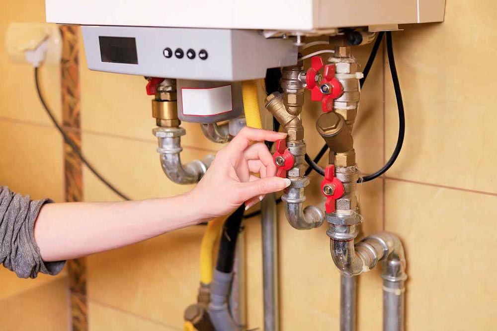 homeowner looking at water heater